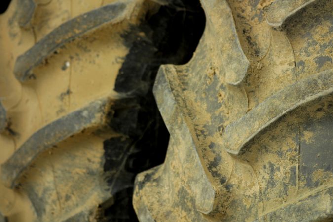 A very dirty and muddy tractor tire