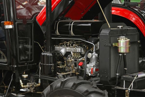 Diesel engine of a new red tractor